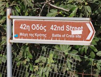A sign on a pole

Description automatically generated