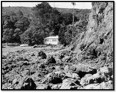 A house near a rocky cliff

Description automatically generated
