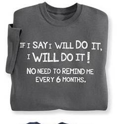 A folded grey shirt with white text

Description automatically generated