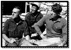 A group of men sitting on the ground

AI-generated content may be incorrect.